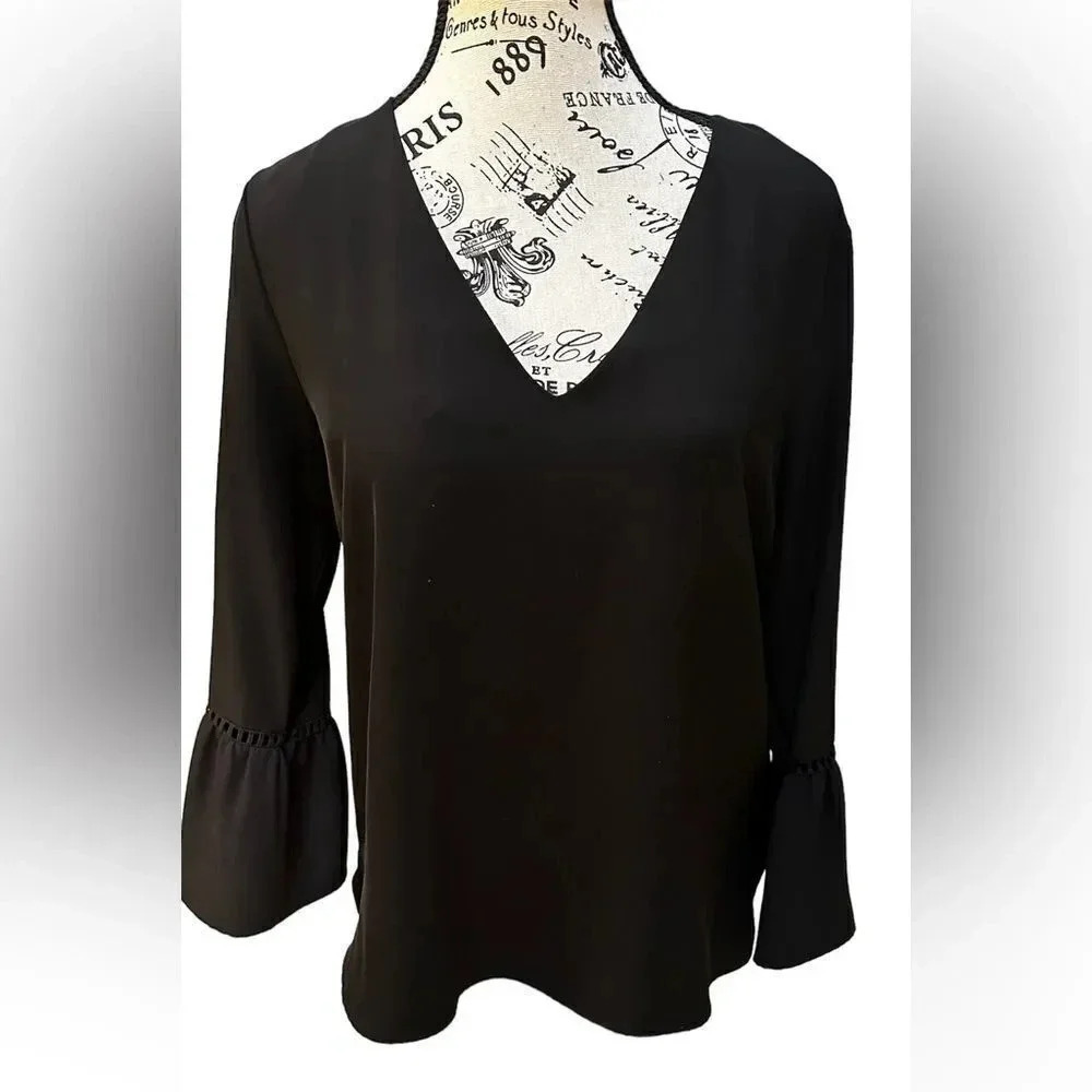 Calvin Klein black blouse with ruffle sleeves. Size small petite